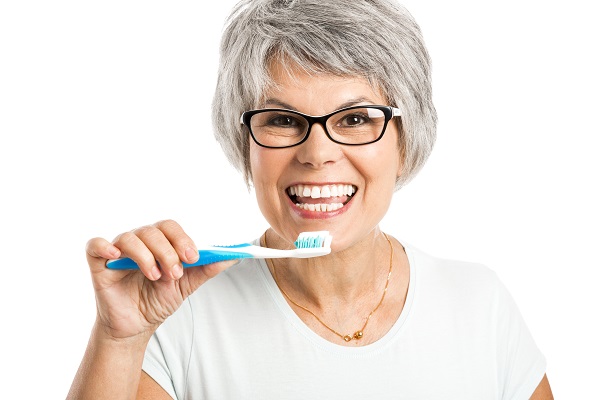 Portrait,Of,A,Happy,Old,Woman,Brushing,Her,Teeth