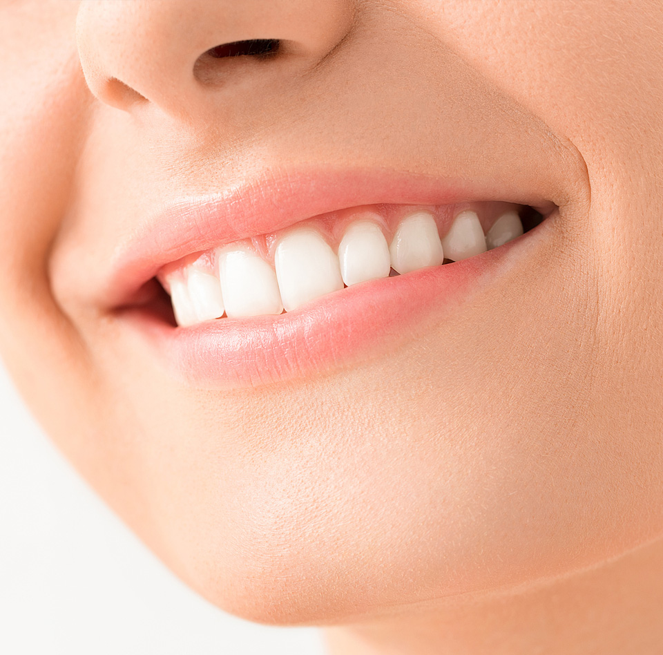 Beautiful female smile after teeth whitening procedure