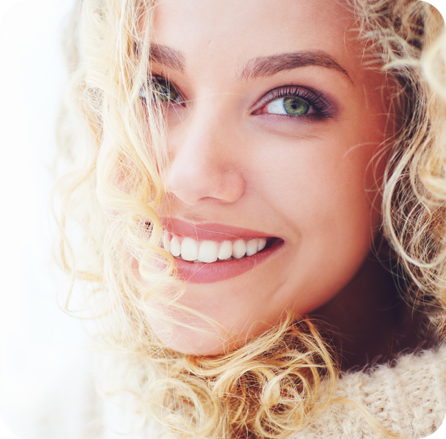 Portrait of beautiful woman with curly hair and adorable smile