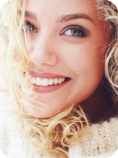 Portrait of beautiful woman with curly hair and adorable smile