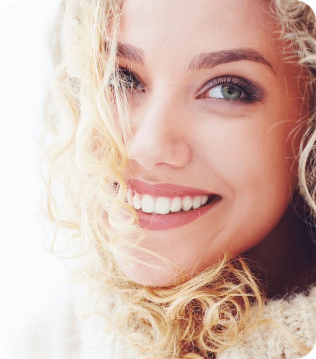 Portrait of beautiful woman with curly hair and adorable smile